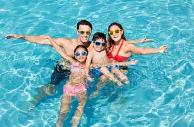 Family in the outdoor pool
